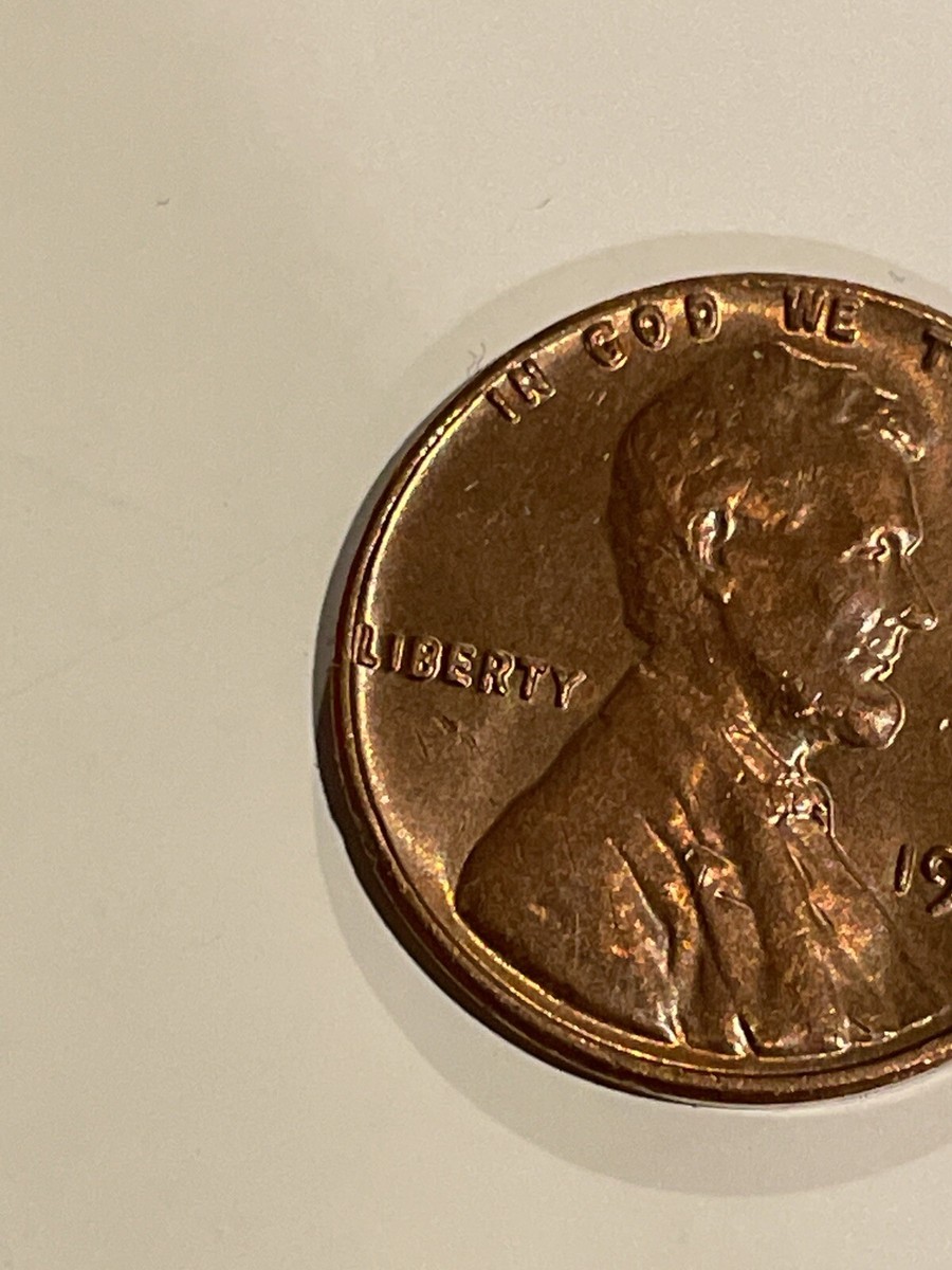 1962 penny no mint mark L in Liberty on edge also In God We Trust