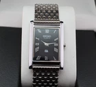 Vintage Seiko Slim Quartz Men's Wrist Watch Black Dial with Silver Bracelet.