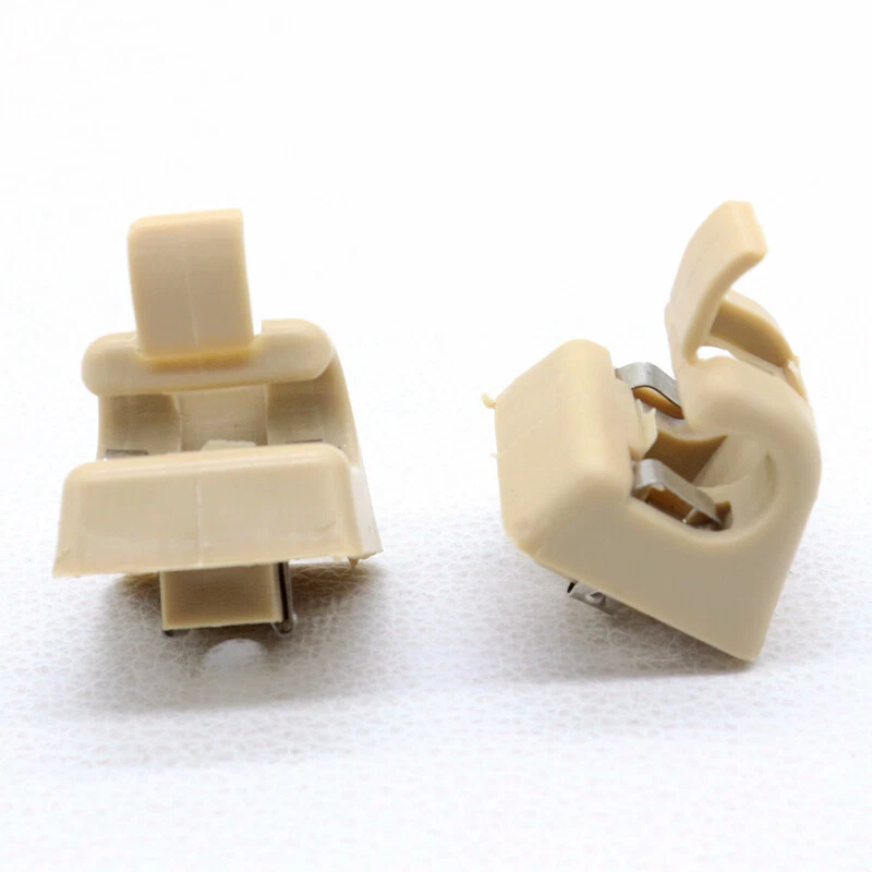 Clip de soporte de parasol de plástico beige 2 piezas para Mercedes-Benz 126-810-00-12-8412 Foto 2 de 4