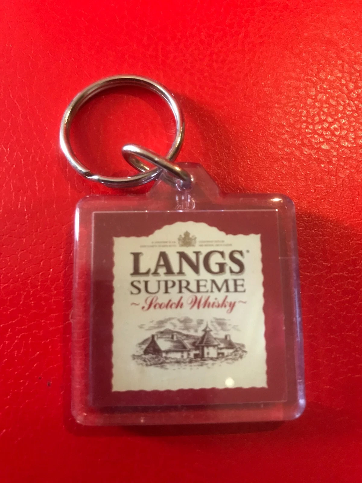 Langs Supreme Scotch Whisky keyring brewerania collectable, lightweight