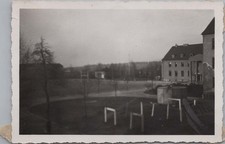 WW2 Photo of Training Yard With Obstacles Near Barracks