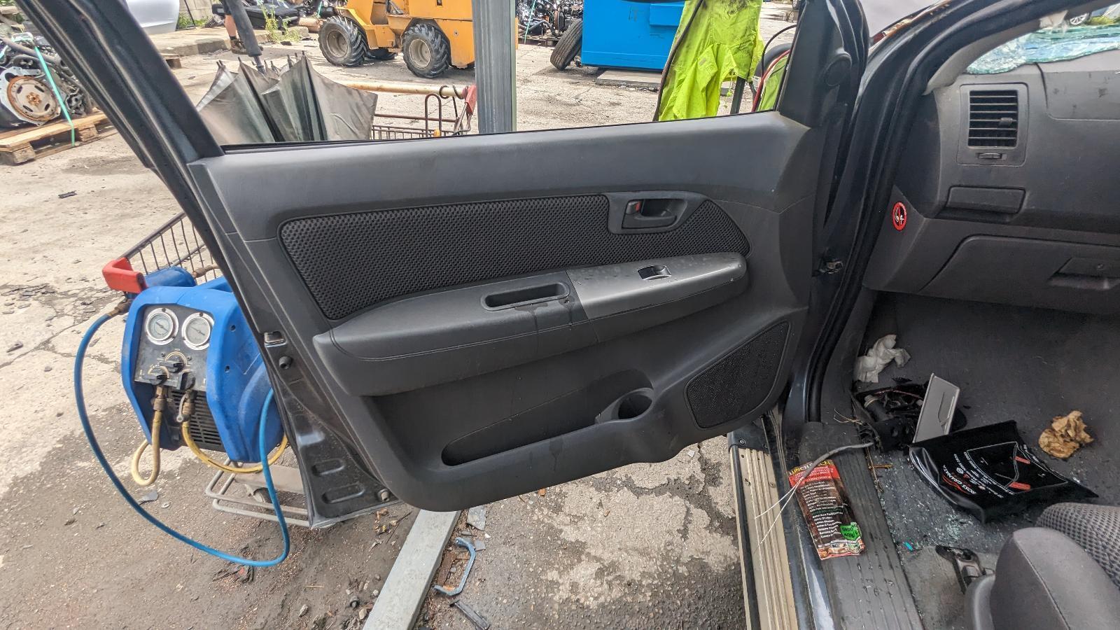 TOYOTA HILUX DOOR TRIM LEFT FRONT, POWER WINDOWS, DARK GREY PLASTIC, 07