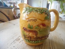 Old Jersey cream jug,relief decor. kitchenalia.