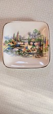 Vintage Retro antique Sandland ware plate in an old world garden