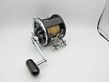 Daiwa Sealine 600H conventional reel w/ clamp & line- RP