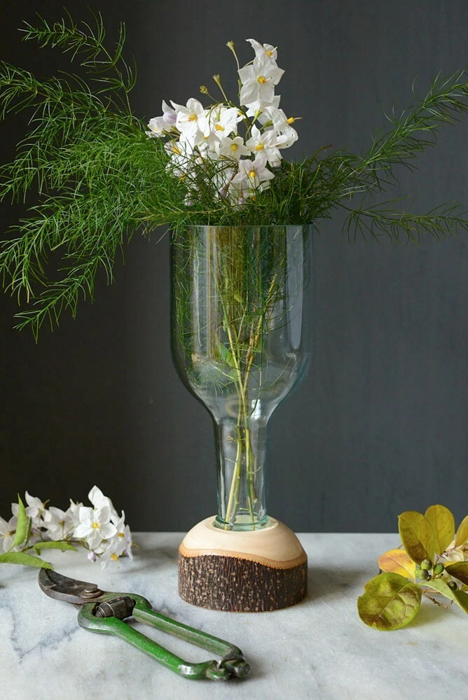 Glass vase handmade from an upcycled wine bottle with hand-turned hardwood base