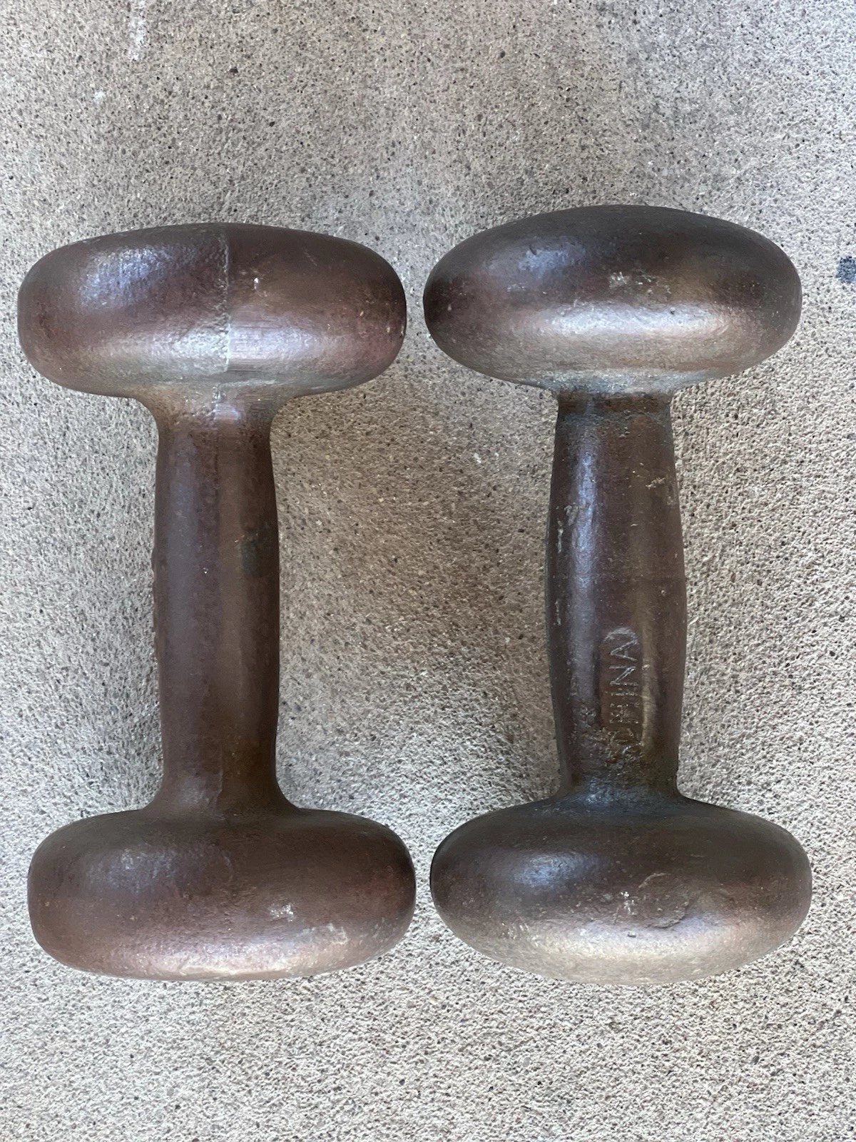 2 BFCO 10 LB. Weights 20lbs. ( One is marked China ) Each a little different