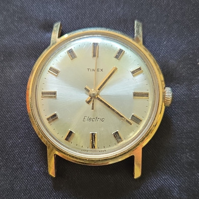 vintage Timex Electric watch features a gold-plated case
