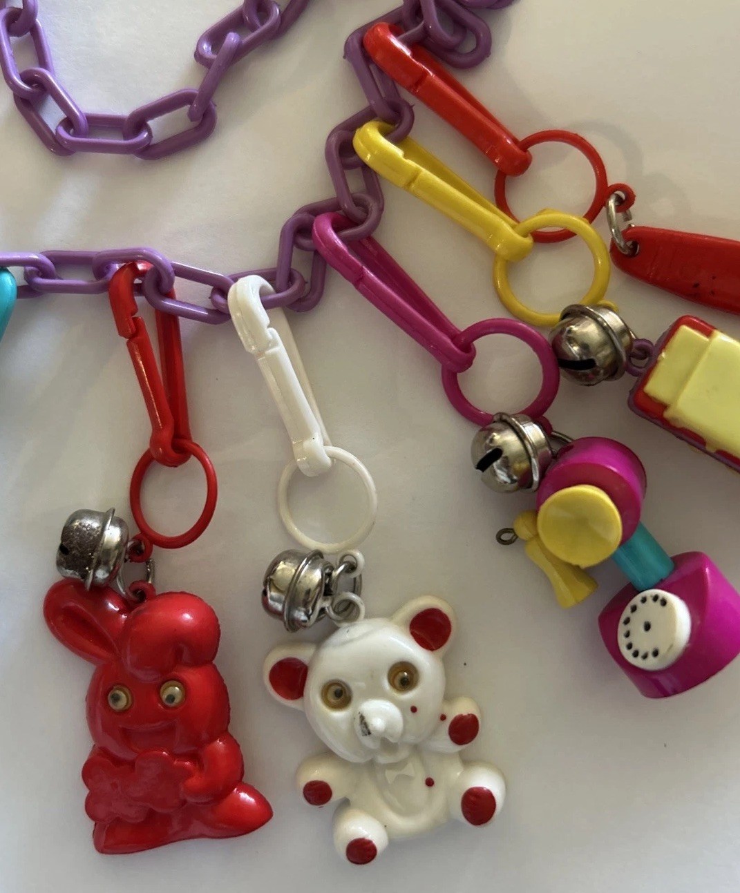 Vintage Plastic Bell Clip 23” Charm Necklace with 8 Charms 1980’s