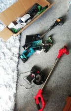 3 X CORDLESS GENERIC MAKE STRIMMERS WITH BATTERIES2 XUSED 1 XNEW