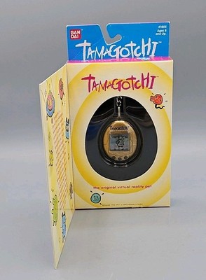 Original 1996-97 Tamagotchi #1805 Gold, Black Buttons, Original