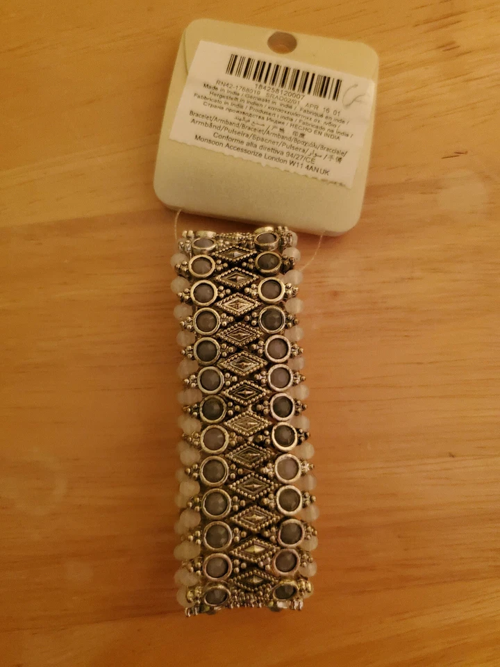 Pulsera Accesorio Nueva. Azul gris, plata, blanco. 3 pulgadas de diámetro. 1 pulgada de grosor. Foto 2 de 2