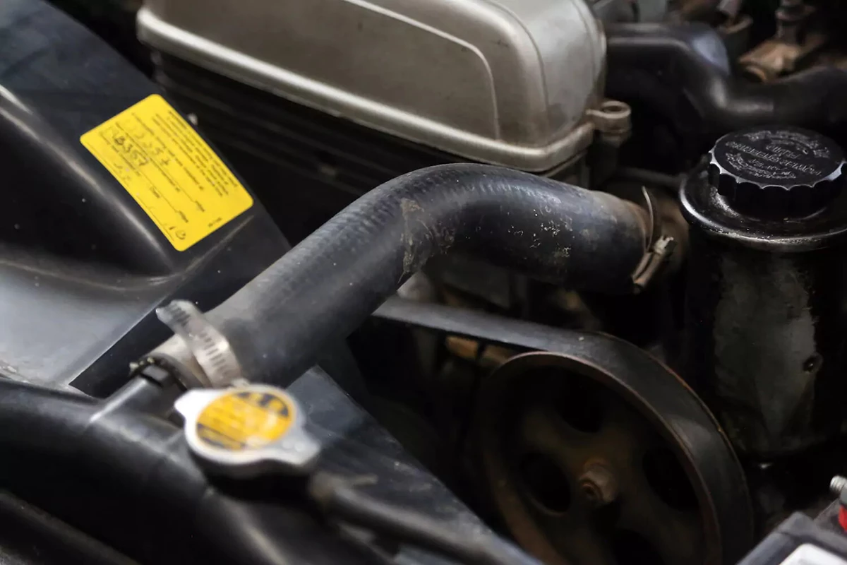Radiator hose on an engine.
