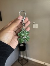 green patent leather Coach four-leaf clover keychain bag charm