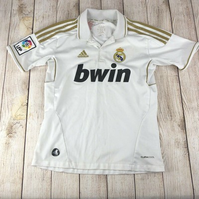 white and gold soccer jersey