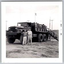 Vtg B W Snapshot Two Men Standing By Large Military Truck With Passengers 1959