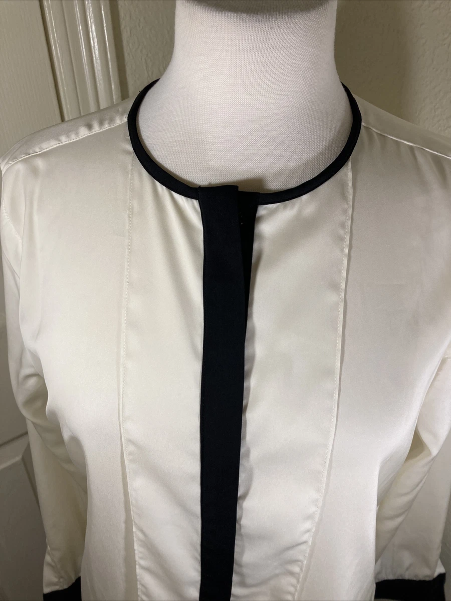 cream blouse with black trim