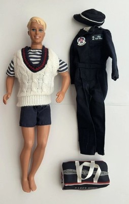 Ken Doll & 2 outfits. 