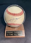 Frank Thomas Autographed Rawlings Baseball - NO COA, with display.