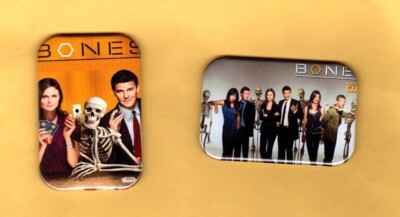 BONES    TWO  MAGNETS OR BUTTONS, PINBACK 2''X3'' W/ ROUNDED CORNER