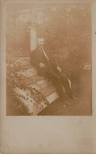 WELL DRESSED MAN SITTING ON STEPS FASHION PORTRAIT REAL PHOTO POSTCARD 1910 RPPC