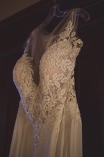 Allure wedding dress with illusion neck line and flowing lace train