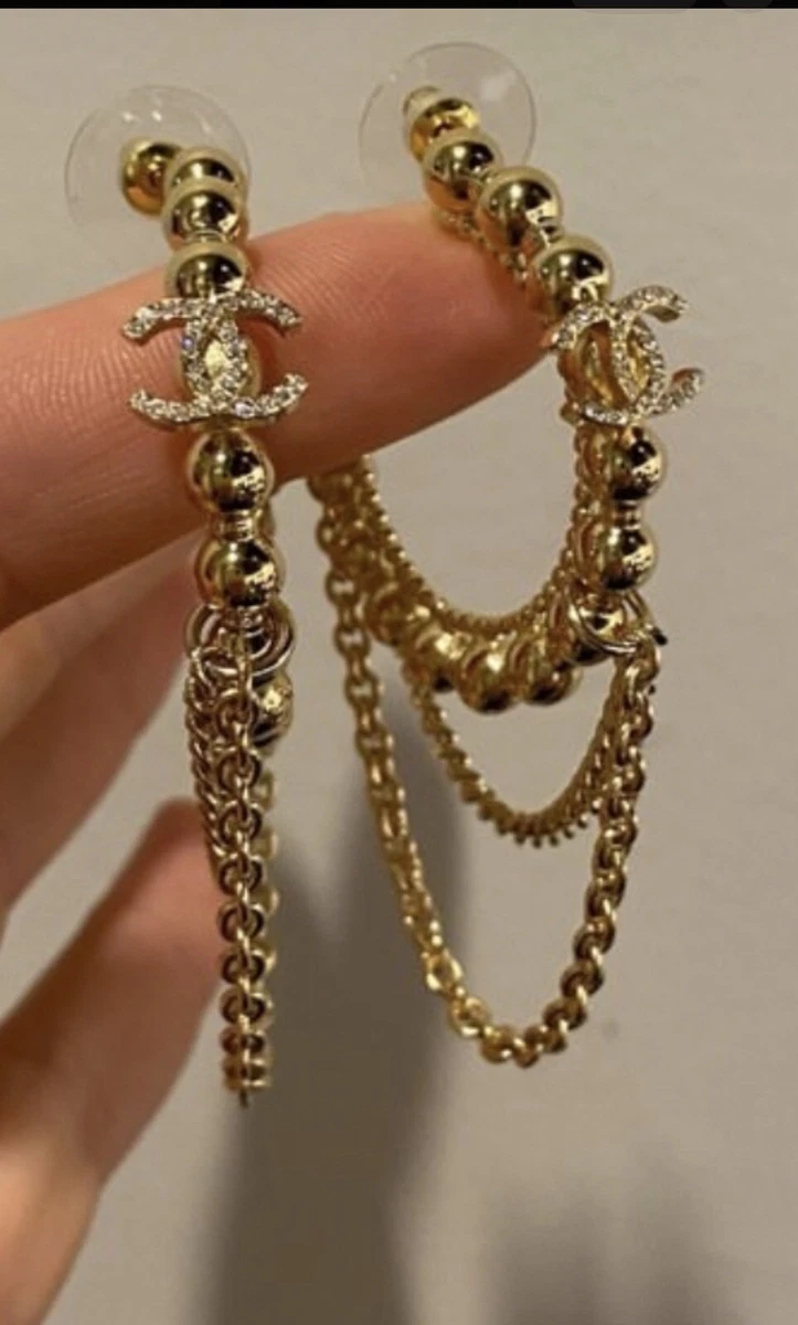 Chanel gold metal and crystals logo dangle earrings new