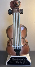 Vintage musical Jim BEAM decanter violin that plays Beethoven's Fifth Symphony. 