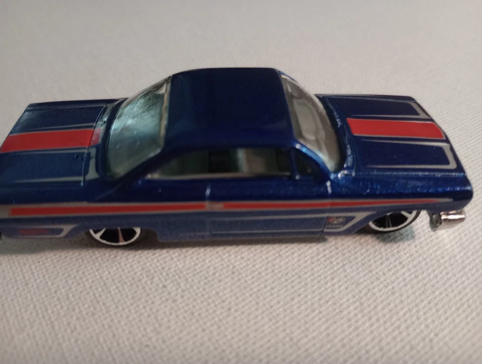 Chevy Impala 2012 Hotwheels Muscle Mania GM '62 azul 5 velocidades ruedas cromadas  Foto 2 de 4