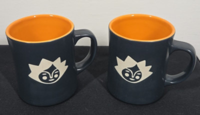 Starbucks 16 oz Mugs 2011 Set of 2 Kenya Sun Face Etched Matte Black 0543
