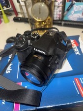 Panasonic Lumix DMC-FZ70 16.1MP Digital Camera 60x Zoom + Hoya Filters + Bag