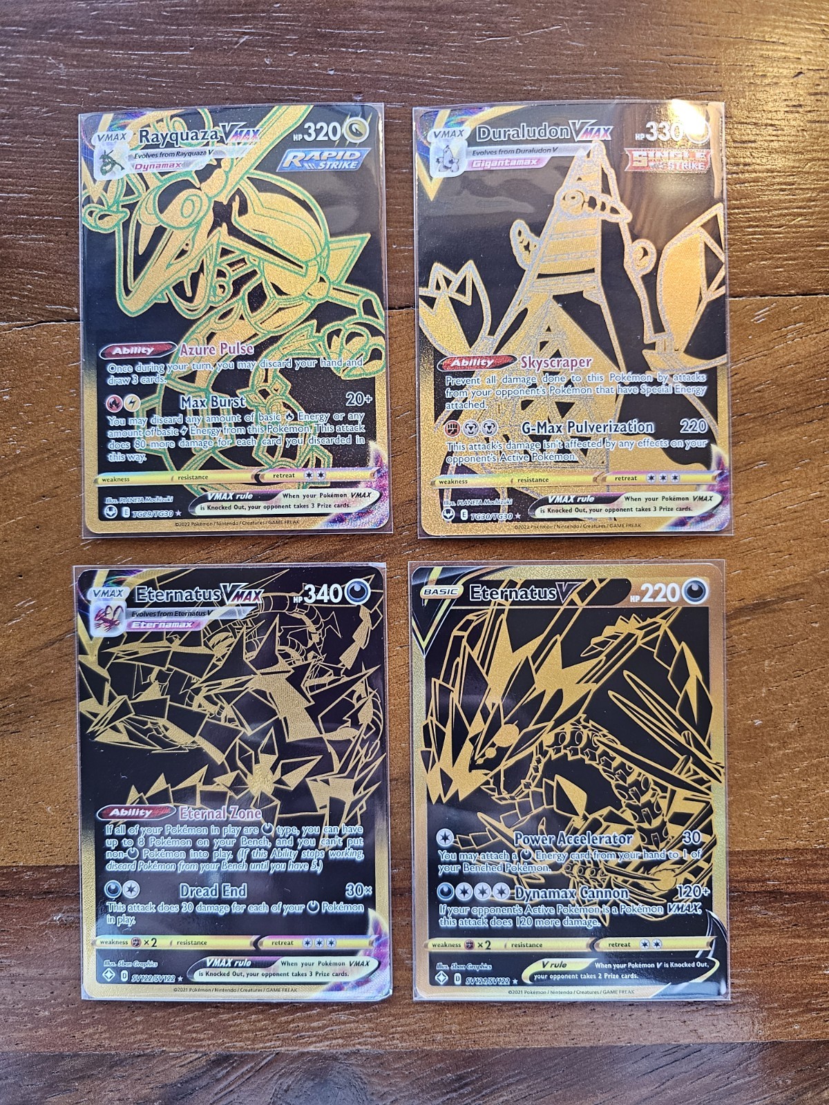 Pokemon 4 Card Lot Gold/Black (Rayquaza Vmax, Eternatus Vmax, More)