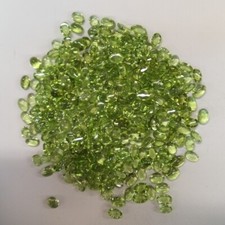PERIDOT 50 FULL CARATS OF 6 x 4 MM OVAL CUT CABOCHONS COMMERCIAL GRADE