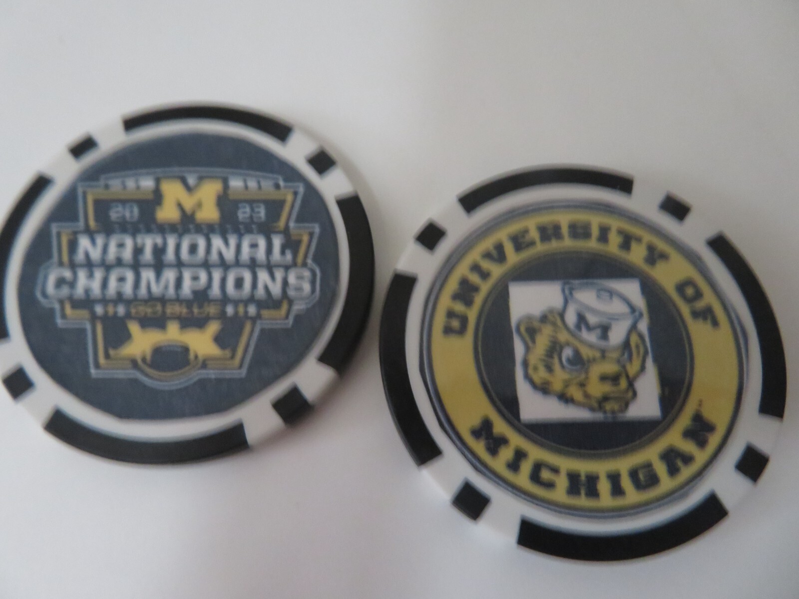 MICHIGAN WOLVERINES 2023 CFB #1 CHAMPIONS, LOT OF 2 POKER CHIPS OR GOLF MARKERS