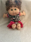 Cabbage patch kids doll+curly brown hair+green eyes+zebra print dress