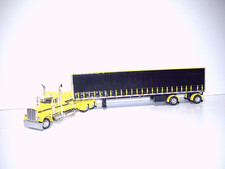 DCP FIRST GEAR 1/64 YELLOW PETE 379 WITH SLEEPER SPREAD AXLE TAUTLINER TRAILER