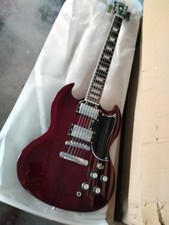 Red SG electric guitar with 6 strings and black guard plate in stock