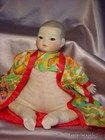 VINTAGE ORIENTAL STYLE CHINA HEAD & CLOTH BABY DOLL — photo 2