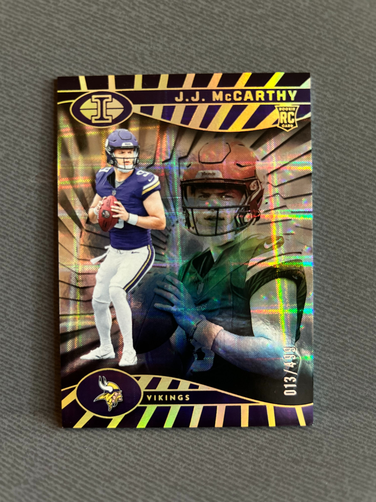 J.J. McCarthy 2024 Panini Illusions #100 Trophy Collection Mirrored 013/499 (RC)