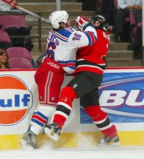 Dan McGillis New Jersey Devils takes the hit from Ryan Hollw- Ice Hockey Photo