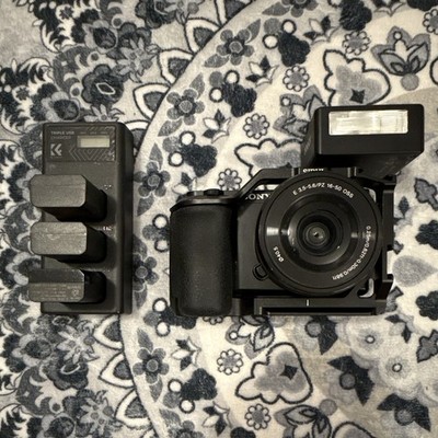 Sony Alpha ZV-E10 Bundle w/ 16-50mm OSS Lens, Cage, Flash & Triple USB Charger