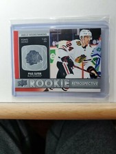 2021-22 Upper Deck Series 1 Hockey Pius Suter Rookie Retrospective card # RR-11