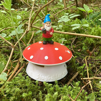 SlugGetter Gnome on Mushroom Garden Slug Trap. Cute pest control ornament.