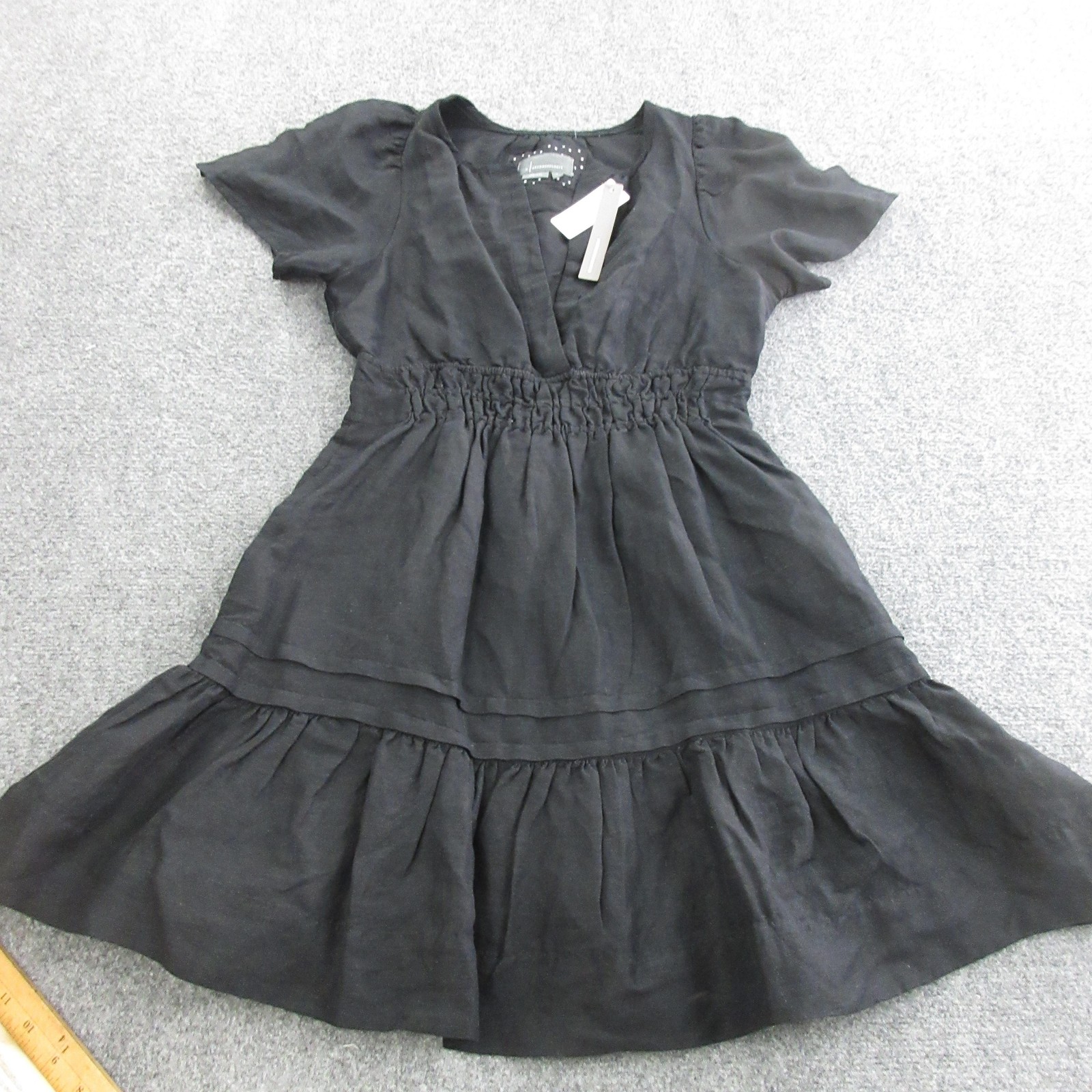 Vestido corto Anthropologie para mujer S negro lino viscosa ajuste acampanado volantes en capas