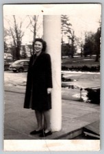 Vtg B&W Snapshot Woman in Coat By Column 1940s