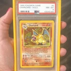 Charizard Base Set Holo 4/102 PSA 8 1999 with slab guard