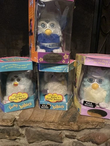 4 Vintage Furby. In Boxes. Tested 3 Work Perfectly. Millennium Edition Does Not.