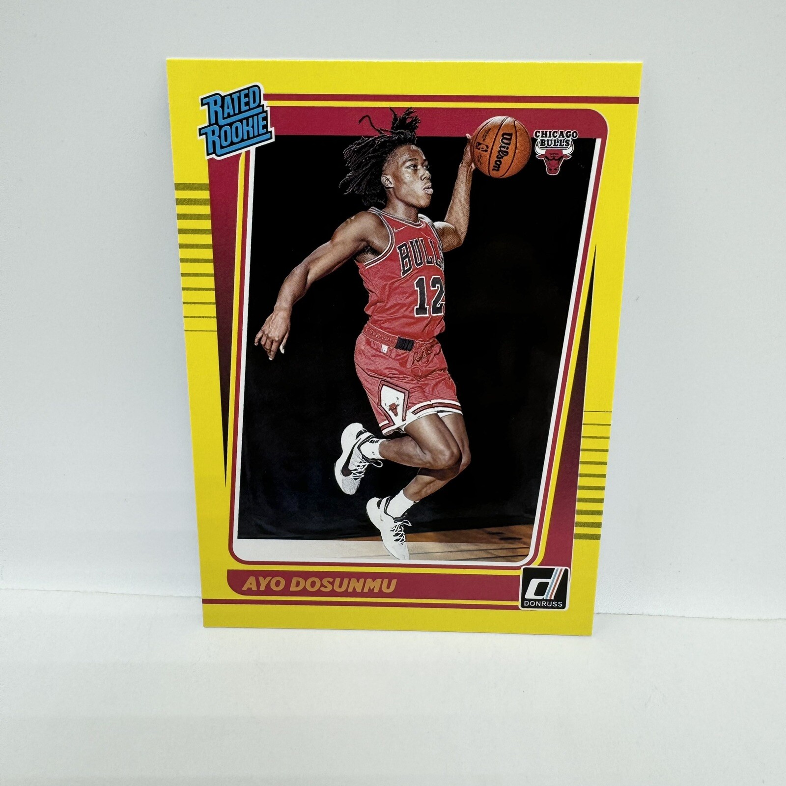 2021-22 Panini Donruss Ayo Dosunmu Yellow Flood Rated Rookie #221 Chicago Bulls