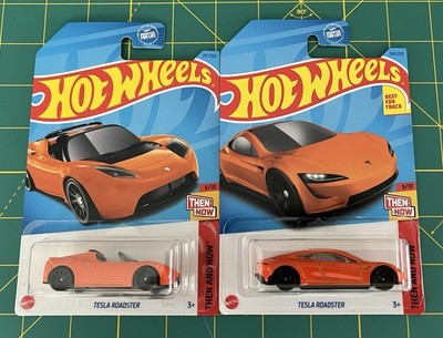 LOT OF 2 - 2023 HOT WHEELS TESLA ROADSTER THEN AND NOW 6/10 AND 9/10 ORANGE