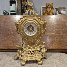 vintage West German Baroque style mantel clock. Cast metal with gilt finish. 